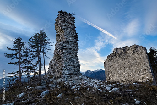 The medieval ruins of San Pietro castle stand out on the top of Mount Ciolino. Torcegno, Valsugana, Trento province, Trentino Alto-Adige, Italy, Europe. photo