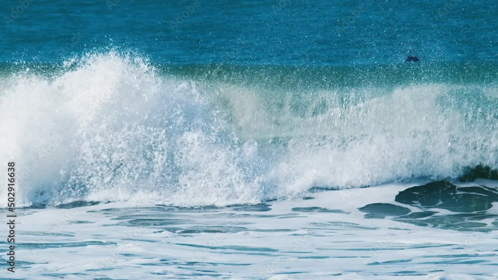 Powerful wave breaks over the sandy beach. Atlantic ocean, Brazil Powerful wave breaks over the sandy beach. Atlantic ocean, Brazil