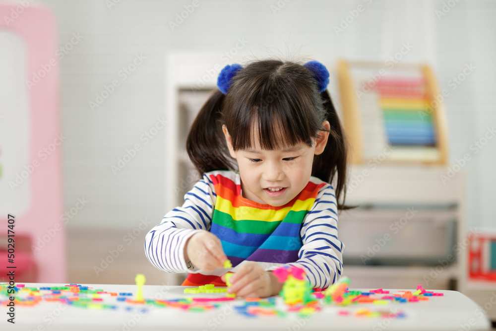young girl playing creative blocks for homeschooling young girl playing creative blocks for homeschooling