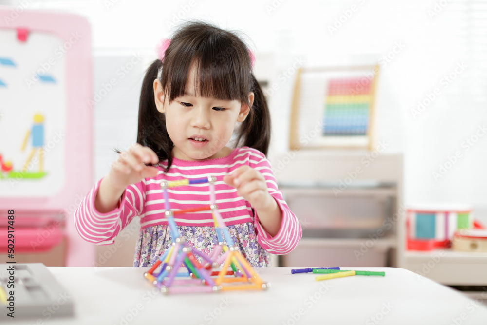 young girl playing creative 3d shape toy for homeschooling young girl playing creative 3d shape toy for homeschooling