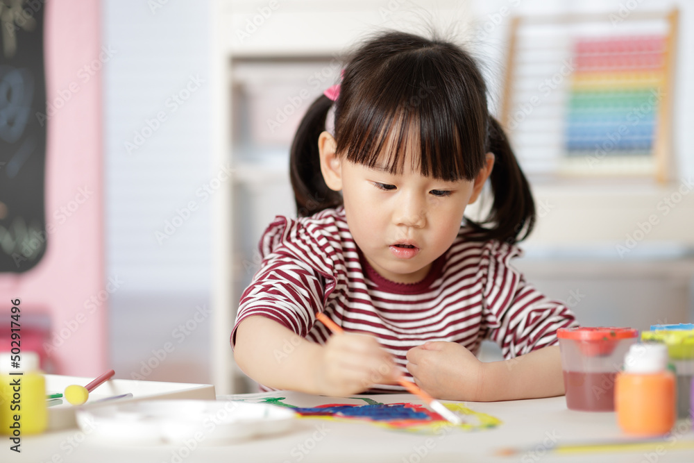 young girl painting hand made craft at home young girl painting hand made craft at home