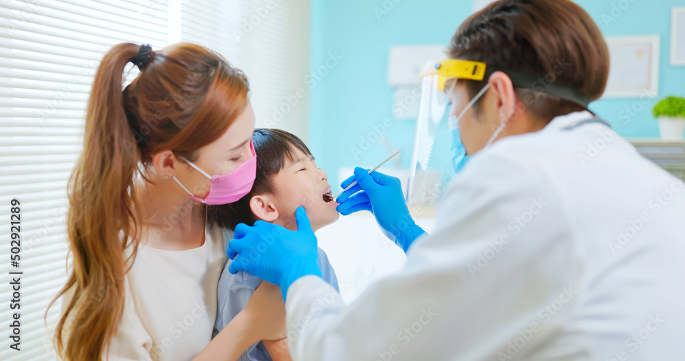 dentist examining toothache boy dentist examining toothache boy