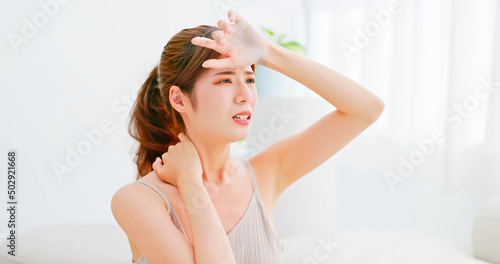 woman unhappy touch her face
