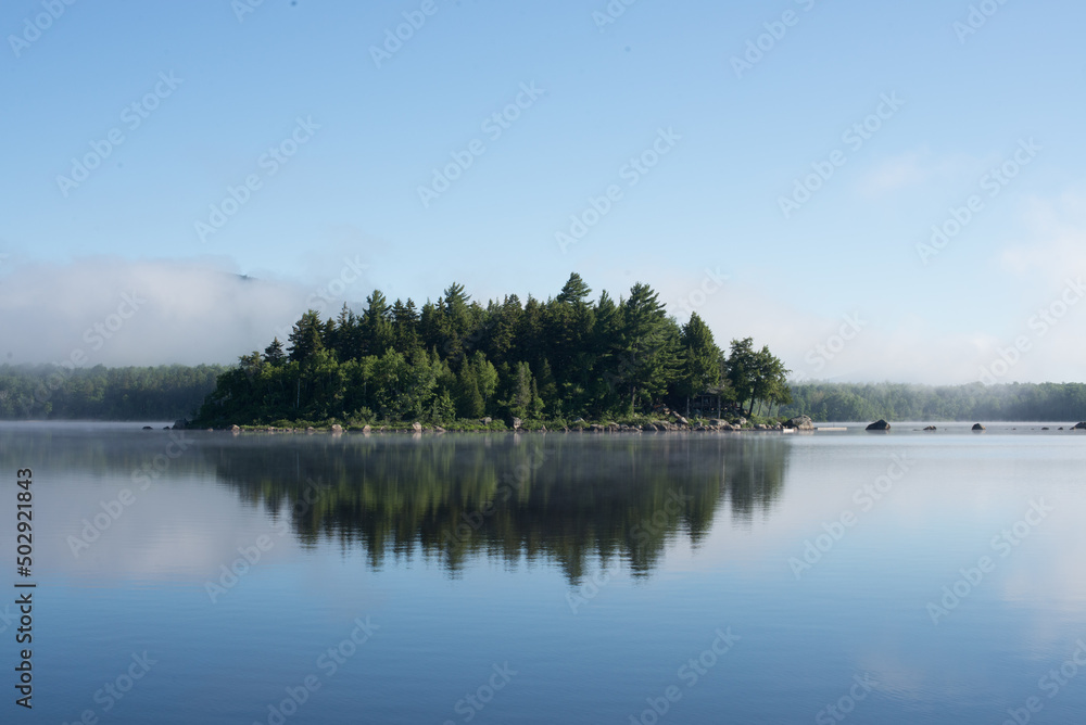 Fototapeta premium An Island in a Lake with Mist