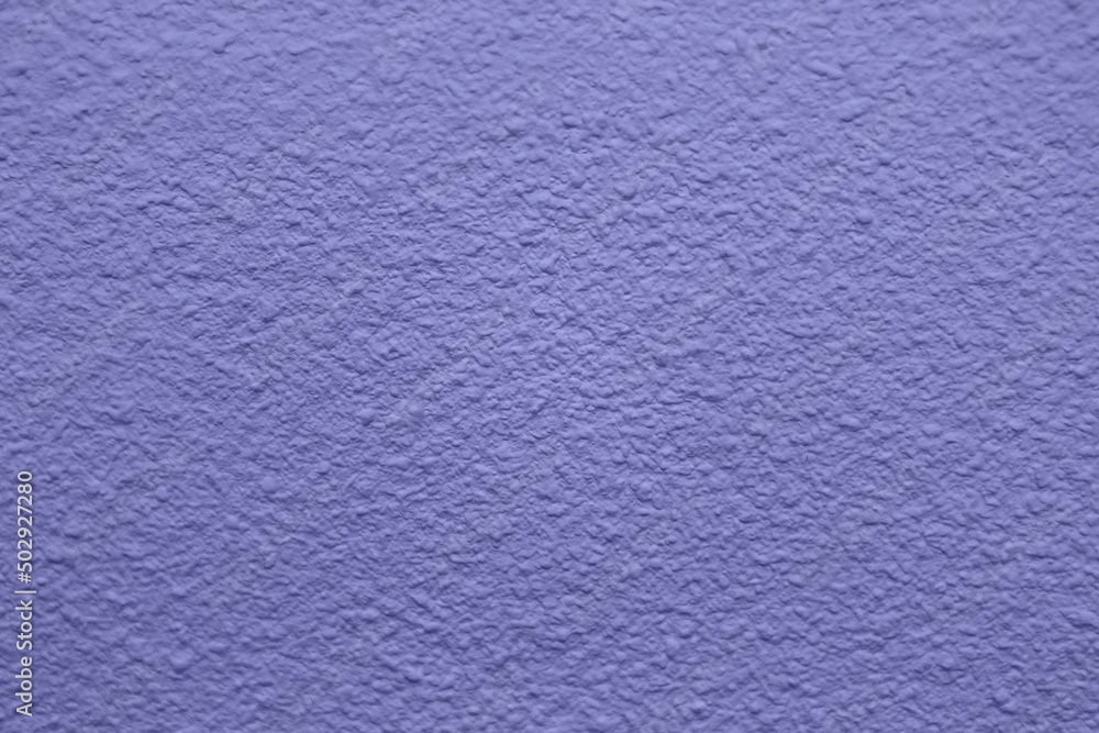 Very peri - color of the year 2022. Wall background. Art rough stylized texture, wallpaper Very peri - color of the year 2022. Wall background. Art rough stylized texture, wallpaper