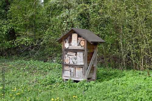 Wooden structure for bees and insects in an outdoor area. No people. © Cerib