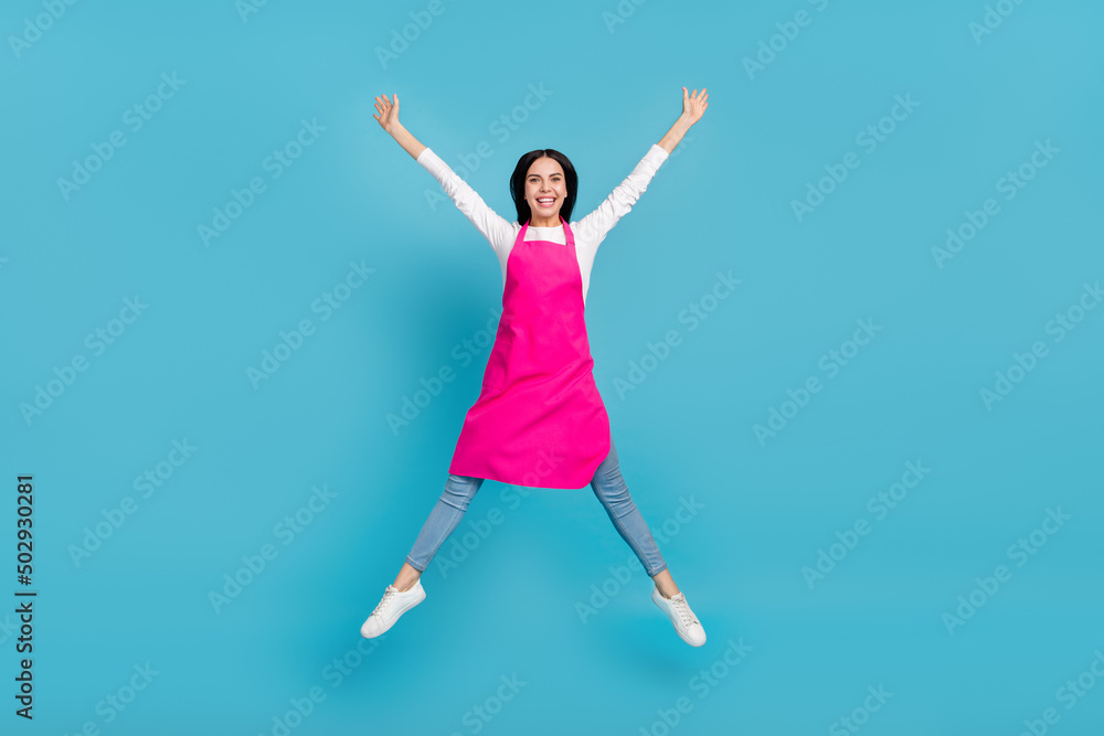 Full length body size view of attractive cheery girl specialist jumping having fun isolated over bright blue color background Full length body size view of attractive cheery girl specialist jumping having fun isolated over bright blue color background