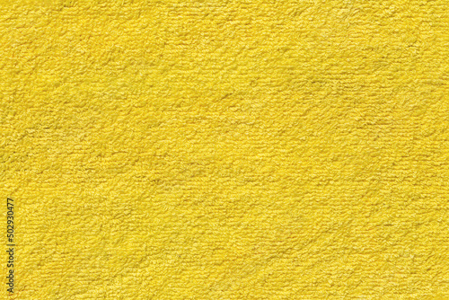 Yellow towel surface as background.