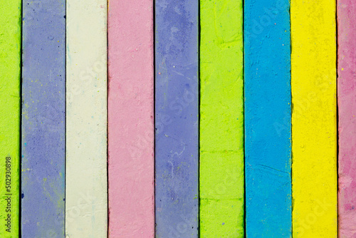 Lots of colored chalk as background, texture, pattern.