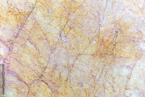 Polished marble surface with dark purple cracks as background  texture  pattern.