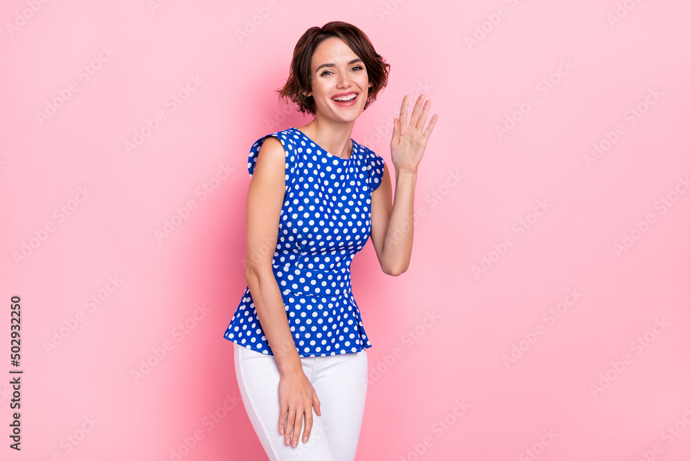 Photo of hooray millennial bob hairdo lady wave wear dotted blouse isolated on pink color background Photo of hooray millennial bob hairdo lady wave wear dotted blouse isolated on pink color background