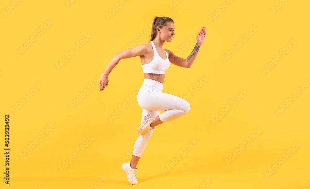 fitness girl runner running on yellow background