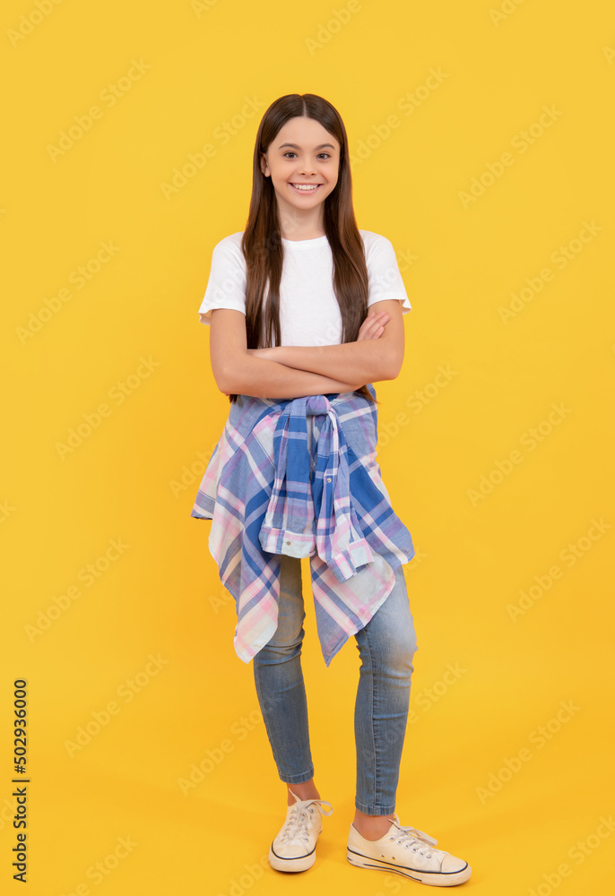 hipster cheerful child in casual clothes full length on yellow background hipster cheerful child in casual clothes full length on yellow background