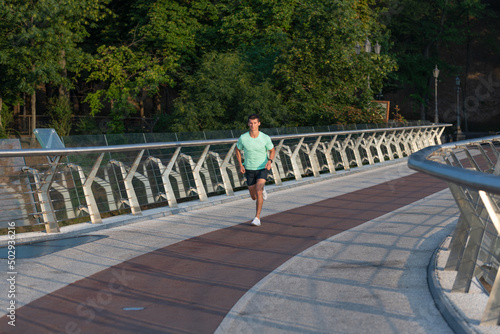 athletic man runner jogging in sportswear outdoor