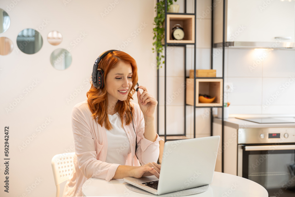 Freelance business women in casual wear using laptop and having call video conference with client while working at home. Freelance business women in casual wear using laptop and having call video conference with client while working at home.