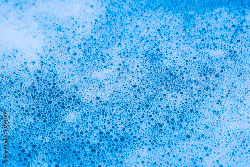 blue foamy water close-up. white bubbles