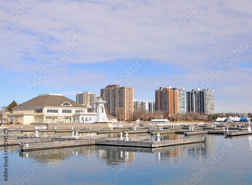View past the the Bronte Outer Harbour Marina on lake Ontario  towards the skyline of Oakville  ON  Canada