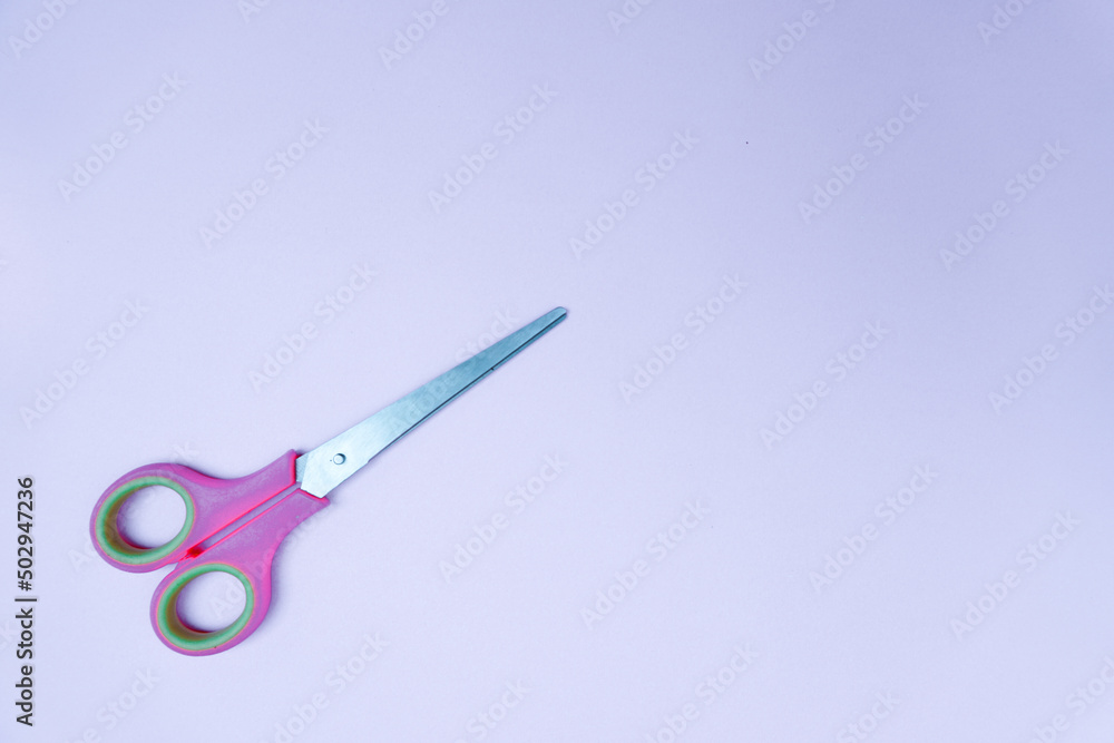 scissor isolated on blue. text space scissor isolated on blue. text space