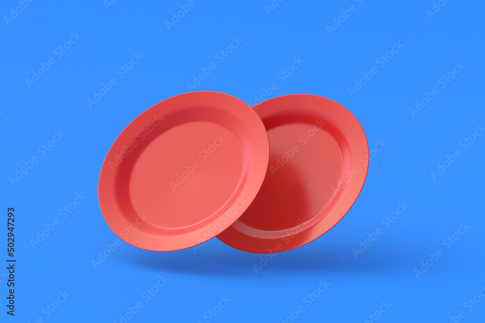 Two red plates on blue background. 3d render Two red plates on blue background. 3d render
