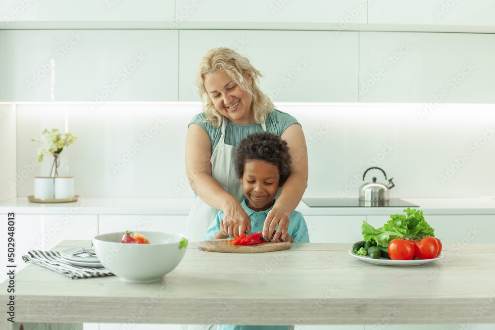 Mom with kid together in the kitchen Mom with kid together in the kitchen