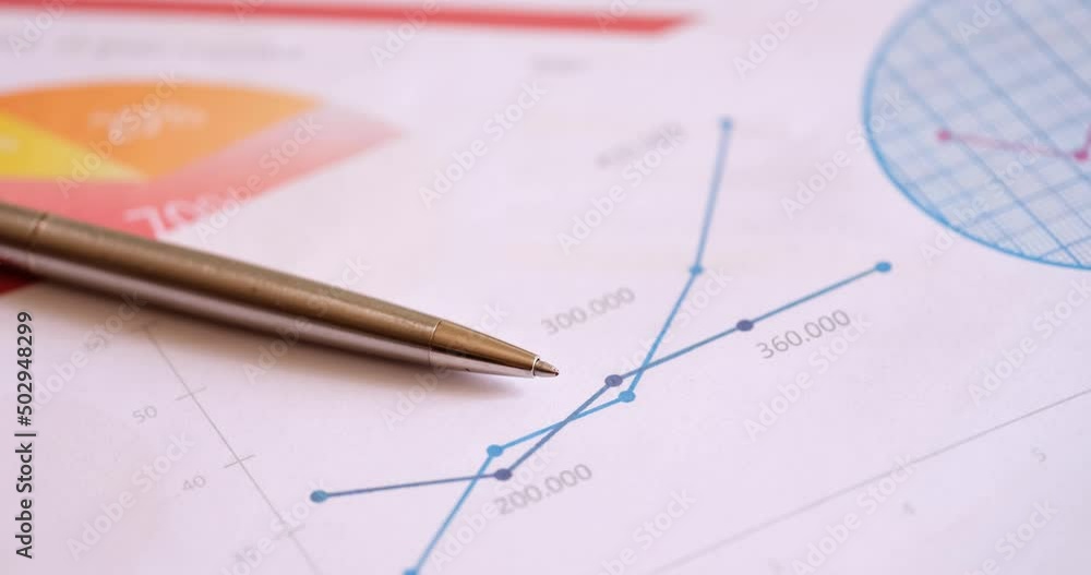 Ballpoint pen and documents with graphs lying on desk for managers closeup 4k movie Ballpoint pen and documents with graphs lying on desk for managers closeup 4k movie