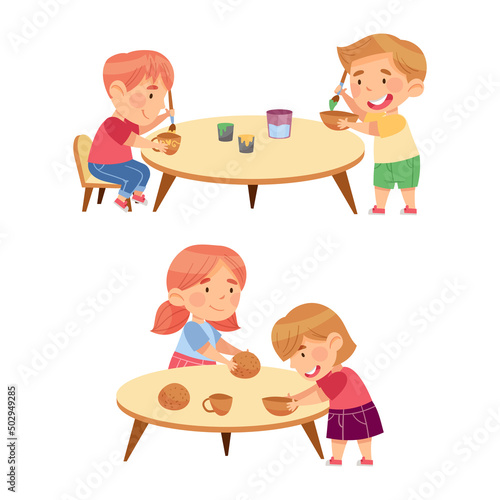 Cute kids playing and learning in kindergarten set. Children decorating their handmade clay pottery cartoon vector illustration