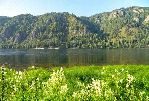 Amazing summer landscape in Siberia. Divnogorsk town with Yenisei river, blue sky, mountains in Russia