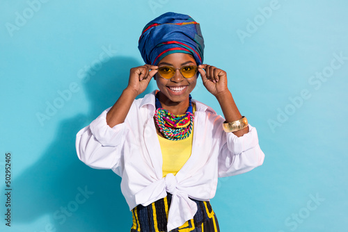 Photo of zulu stunning lady touch specs enjoy native aborigine look isolated on blue pastel color background photo