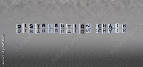 distribution chain word or concept represented by black and white letter cubes on a grey horizon background stretching to infinity