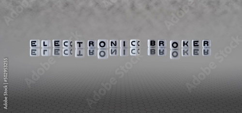electronic broker word or concept represented by black and white letter cubes on a grey horizon background stretching to infinity
