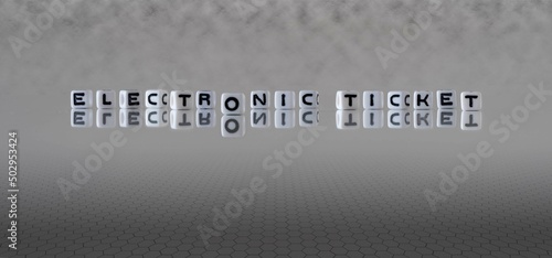 electronic ticket word or concept represented by black and white letter cubes on a grey horizon background stretching to infinity