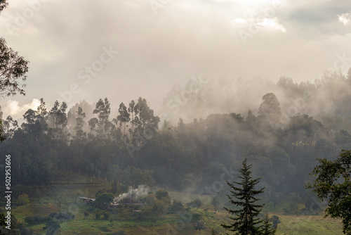 Hazy and misty sunrise over the farmlands at the Andean central mountains of Colombia near the town of Arcabuco