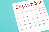 September 2022 calendar sheet on light blue background.