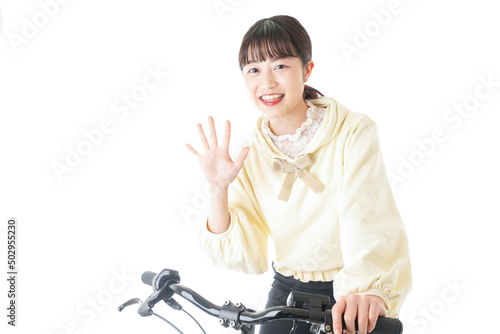 Young woman riding on a bicycle