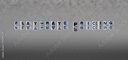 flat rate pricing word or concept represented by black and white letter cubes on a grey horizon background stretching to infinity