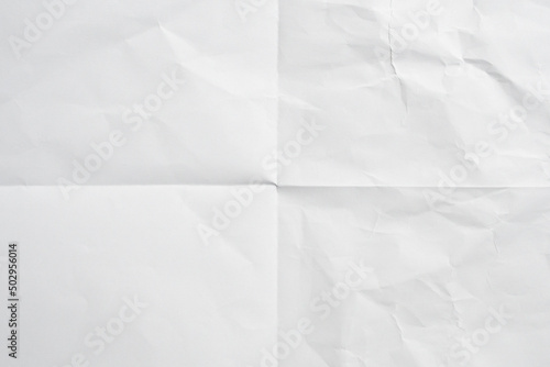 White folded and wrinkled paper texture background