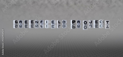 Billede på lærred greenfield project word or concept represented by black and white letter cubes o