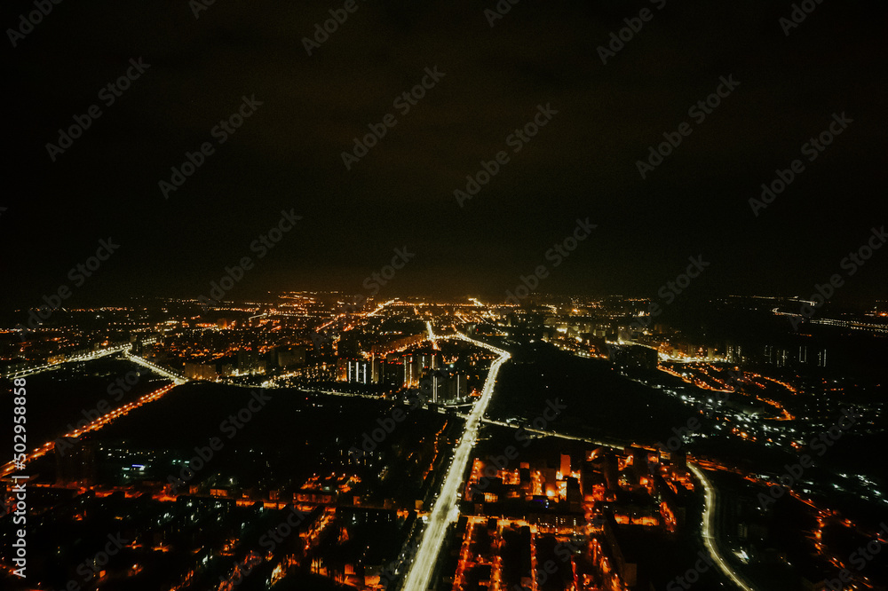 night glowing city, drone view