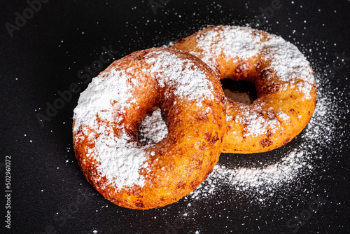 Sugar donut on a black background