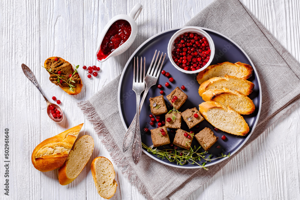 liver pate cubes on plate with toast and berries