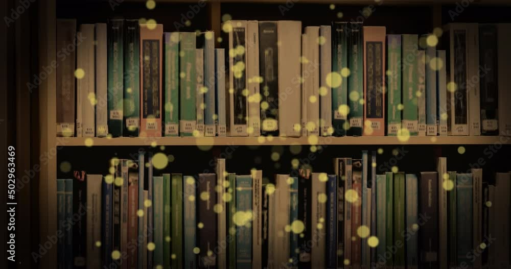 Animation of glowing spots over books on shelf Animation of glowing spots over books on shelf