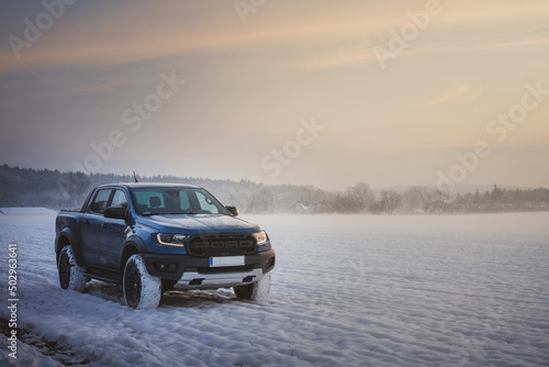 Ford Ranger raptor in the snow at sunset © Michał Matiaszczyk