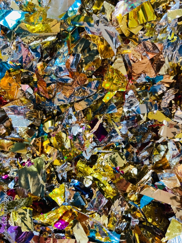 close up of colorful glittering confetti snippets close up of colorful glittering confetti snippets