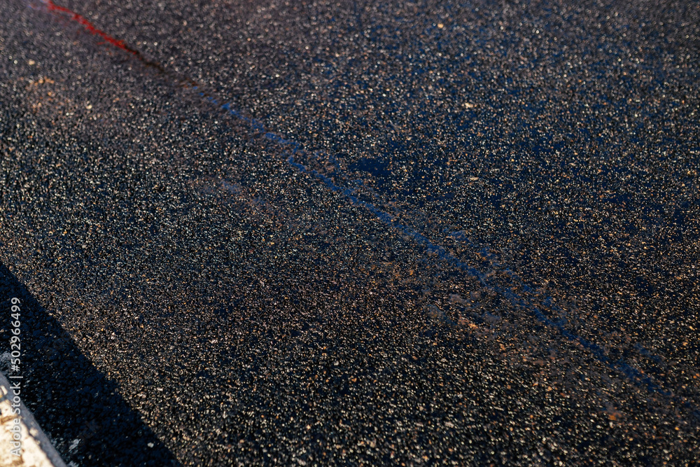 Asphalt road texture. Laying a new asphalt on the road. Construction of the road Asphalt road texture. Laying a new asphalt on the road. Construction of the road