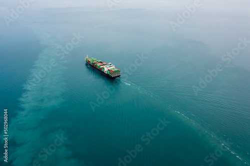 container ship carrying container box global business delivery service cargo by freight shipping commercial trade logistic and transportation over sea worldwide