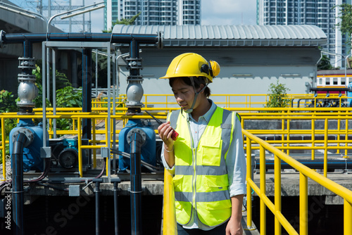 portrait of woman engineer. portrait of a engineer in waste water treatment plant site.