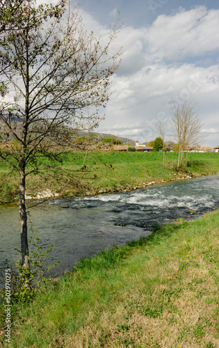 Italian rural landscape. Meschio River. Vertical image. Cordignano, Treviso, Italy.
