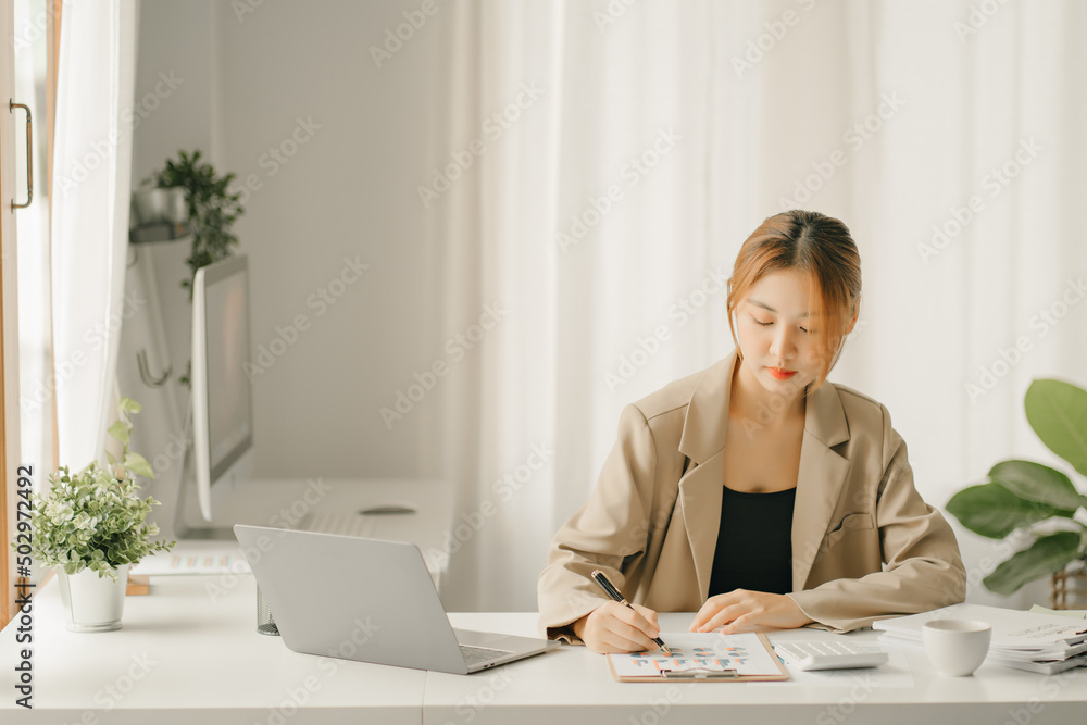 Businessmen are calculating income expenditure and analyzing real estate investment data, Accounting Financial and tax systems concept Businessmen are calculating income expenditure and analyzing real estate investment data, Accounting Financial and tax systems concept
