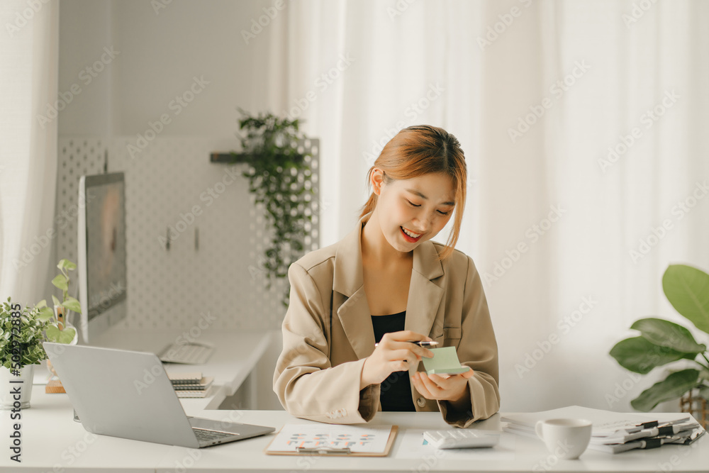 Businessmen are calculating income expenditure and analyzing real estate investment data, Accounting Financial and tax systems concept Businessmen are calculating income expenditure and analyzing real estate investment data, Accounting Financial and tax systems concept