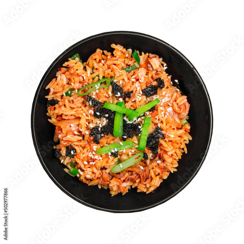 Top view Korean kimchi fried rice topping white sesame and seaweed in a black bowl on the grey concrete table, close-up shot.